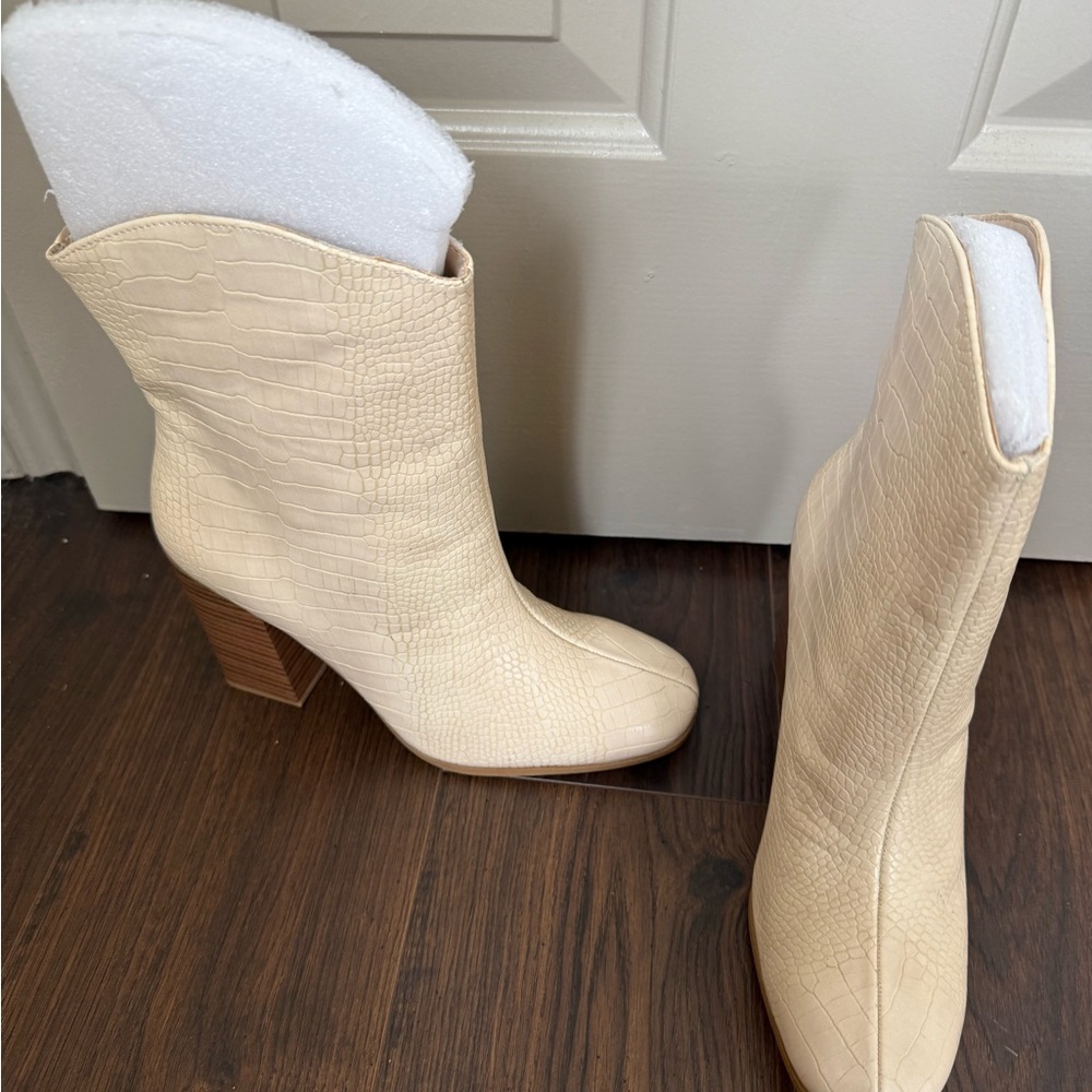 Cream Heeled Boots with Western Silhouette